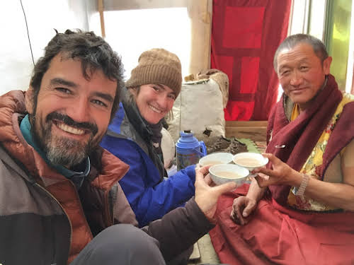 China. Tibetan Region. Sharing a meal with a Tibetan Monk in Yarchen