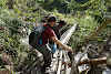 Indonesia. Papua Baliem Valley Trekking. Narrow wood log bridge to Sobaham
