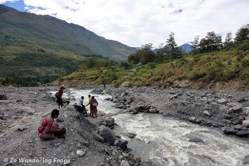 Indonesia. Papua Baliem Valley Trekking Planning. Small bridge and river crossing after a landslide
