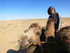 Bruno Riding a Camel by the Khongoryn Els Sand Dunes, Gobi Desert