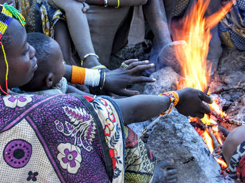 Hadzabe women gathered by the fire