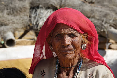 India. Rajasthan Thar Desert Camel Trek. Old lady in the village