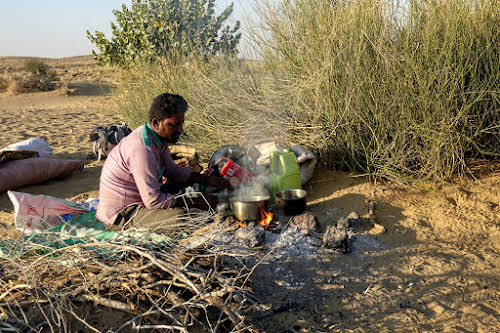 India. Rajasthan Thar Desert Camel Trek. Punja preparing our evening chai