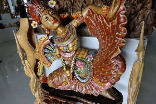 Crafts of Indonesia . Beautifully painted wooden dancer statue