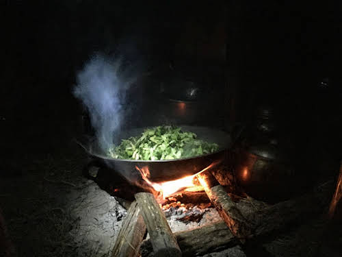 Indonesia. Papua Baliem Valley Trekking. Dinner of rice and vegetables by our Papua host
