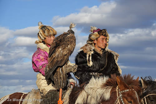 Mongolia. Golden Eagle Festival Olgii. Two of the young participants, including an 11-year old girl