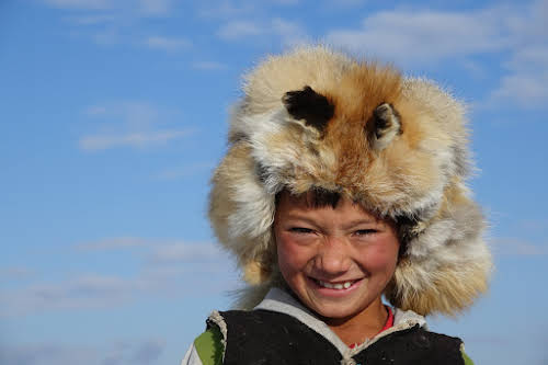 Arkhalykh proudly wearing his grandfather's fox hat