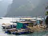 Fishing nets hanging by the houseboats