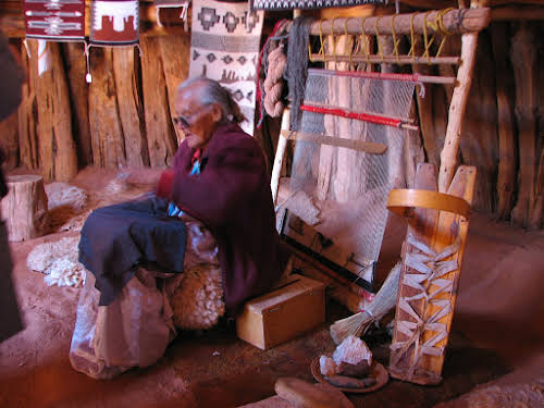 Visiting Monument Valley: How to Experience the Sacred Grounds of the Navajos // Old Navajo woman demonstrating traditional tapestry weaving skills